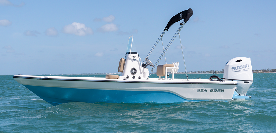 Sea Born FX21 Bay Sharkskin Blue at Rest with Bimini Top - 21 Foot Bay Boat